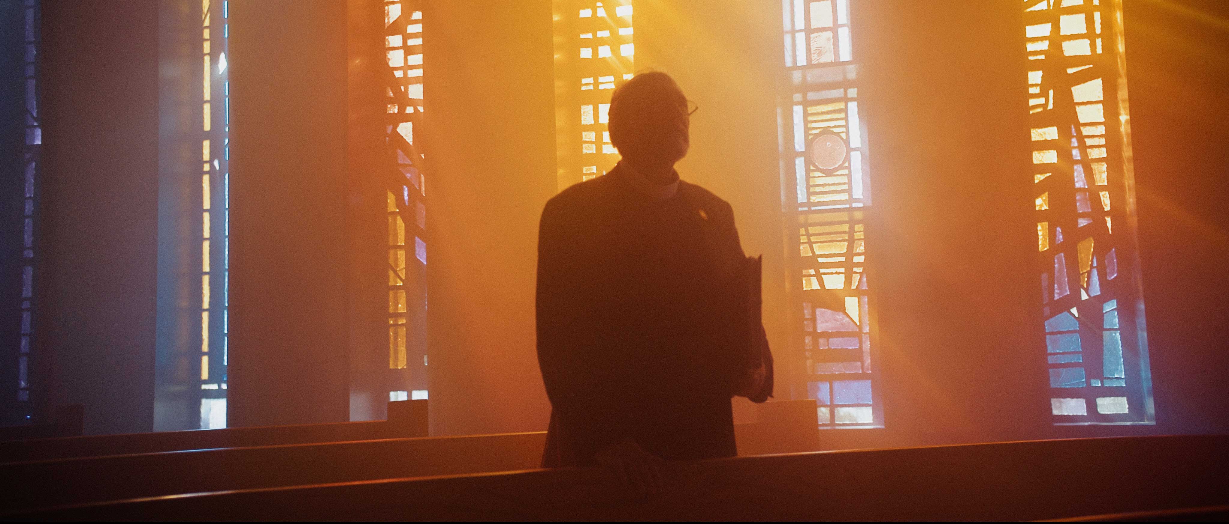 Silhouette in a sunlit church